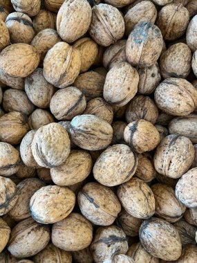 walnuts in shell, lot of walnuts, walnuts background, nuts background, Fruits and vegetables from the market