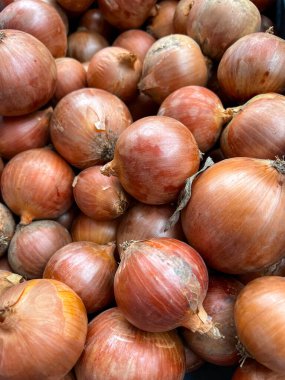 onion background, lots of onions, vegetables from the market