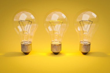 Sonsuz arkaplanda bir sırada parlayan filamanlı üç retro stil ampul; yaratıcılık tasarım konsepti; 3D İllüstrasyon