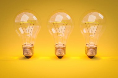 Sonsuz renkli sarı arkaplanda sıralanmış parlayan filamanlı üç retro stil ampul; yaratıcılık tasarım konsepti; 3D İllüstrasyon