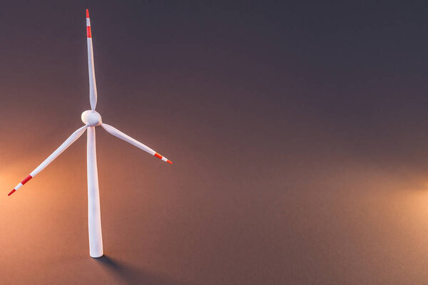 colorfull background; miniature windmill sustainablity renewable energy concept; 3d illustration