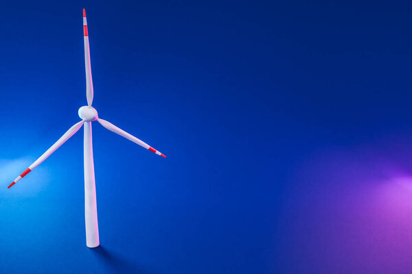 colorfull background; miniature windmill sustainablity renewable energy concept; 3d illustration