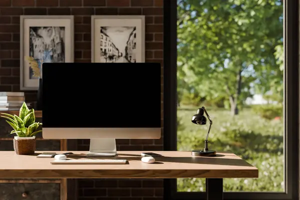 frontal view on modern clean pc workplace; black monitor with copy space; minimalist office background with panoramic view on idyllic garden; digital home office concept; 3D rendering