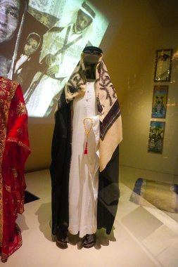 Traditional middle eastern clothes inside National Museum of Qatar In Doha, Qatar clipart