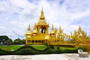 Golden building at the white Temple in WatRong Khun, Thailand clipart