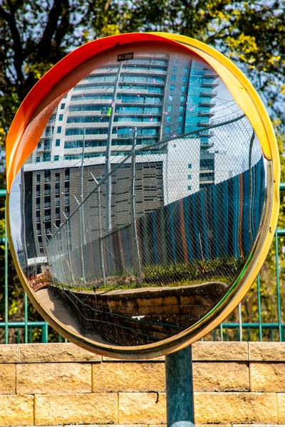 Reflections of an office building in a small mirror in Austin, Texas. High quality photo
