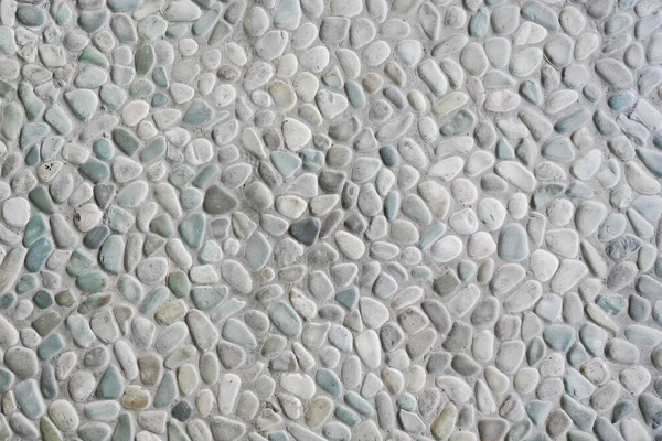 Pebble stone wall texture. Tiles Design for Floor. Background of cobblestone wall texture for design and decoration. Colorful Pebble stone wall texture background for interior exterior decoration and industrial construction concept design.