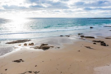 Drone aerial photograph of waves and a white sandy beach on King Island in Tasmania in Australia