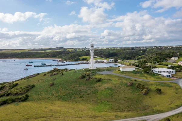 Drone aerial photograph of the Currie Harbour Lighthouse in Currie on King Island in Tasmania in Australia