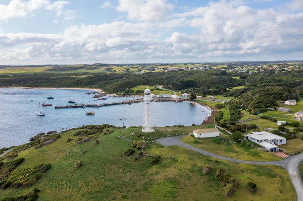 Drone aerial photograph of the Currie Harbour Lighthouse in Currie on King Island in Tasmania in Australia