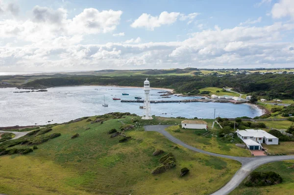 Drone aerial photograph of the Currie Harbour Lighthouse in Currie on King Island in Tasmania in Australia
