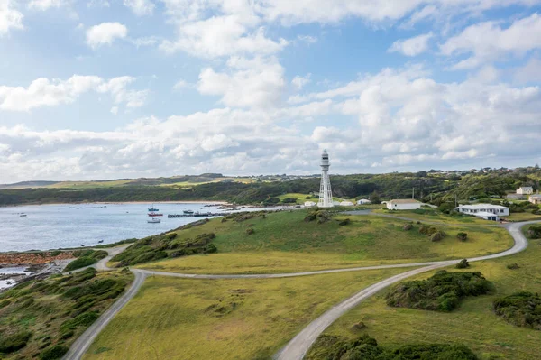 Drone aerial photograph of the Currie Harbour Lighthouse in Currie on King Island in Tasmania in Australia