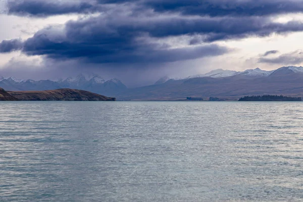 stock image Photograph of Lake Tekapo in the early morning with snow-capped mountains in the background on the South Island of New Zealand