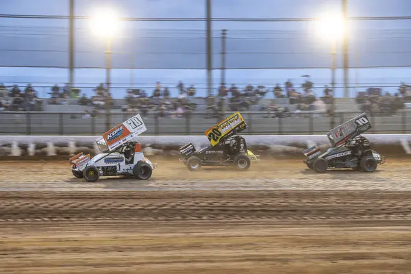 stock image SYDNEY, NEW SOUTH WALES, AUSTRALIA - March 23, 2024 : Driver Kobi Wright racing in the SprintCar Dirt Track Racing Series at Sydney International Speedway.