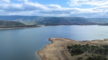 Drone aerial photograph of the Tumut River and Blowering Reservoir in the Snowy Mountains region between the towns of Tumut and Talbingo in the Kosciuszko National Park in New South Wales, Australia. clipart