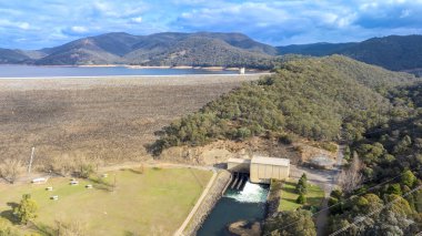 Drone aerial photograph of the Tumut River and the Blowering Dam and Wall in the Snowy Mountains region near the town of Tumut in the Kosciuszko National Park in New South Wales, Australia. clipart