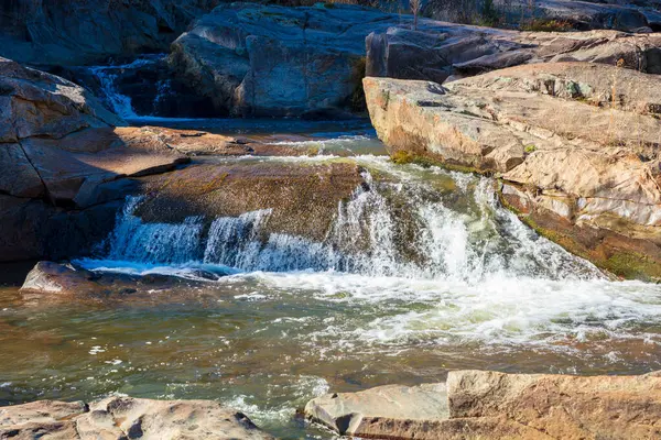 stock image Photograph of water flowing in Adelong creek near the Adelong Falls Gold Mine ruins in the Snowy Mountains in New South Wales in Australia.