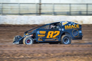 SYDNEY, NEW SOUTH WALES, AUSTRALIA - October 5, 2024: Driver Craig O'Toole in the V8 Dirt Modified Series NSW State Championship at the Sydney International Speedway in Eastern Creek, NSW, Australia. clipart