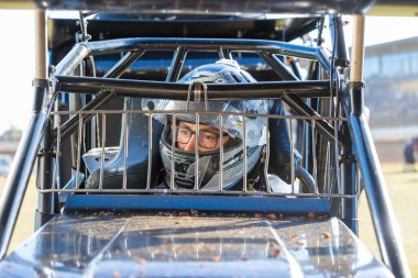 SYDNEY, NEW SOUTH WALES, AUSTRALIA - October 26, 2024: Driver Ben Aitkinson in the Australian Sprintcar Series championship at the Sydney International Speedway, NSW, Australia. clipart