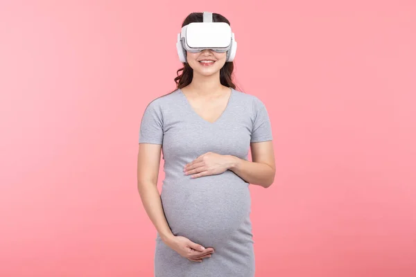 Happy Pregnant Woman Using Virtual Reality Glasses Standing Smile Stroking — Fotografia de Stock