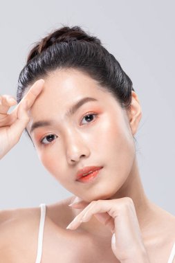 Beautiful Asian woman looking at camera smile with clean and fresh skin Happiness and cheerful with positive emotional,isolated on white background. Beauty and Cosmetics Concept. Proud her self.