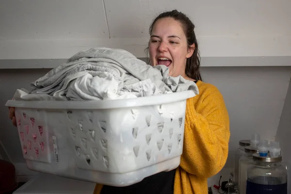 stock image woman with a pile of laundry