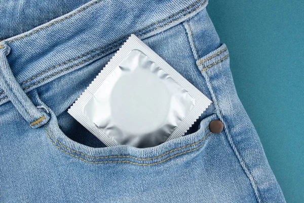 Silver Wrapped Condom Protrudes Front Pocket Jeans Protected Sex Concept — Stock Photo, Image