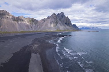 Aerial Drone image of Vestrahorn Black Sand Beach in Iceland. High quality photo. The horned mountains of east Iceland