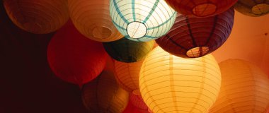 Multicolored Paper Lanterns on Ceiling clipart