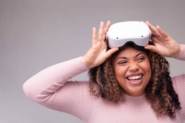 Smiling woman wearing virtual reality headset