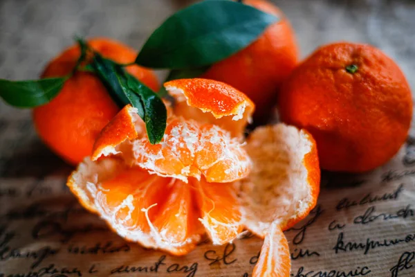fresh tangerines on a newspaper background