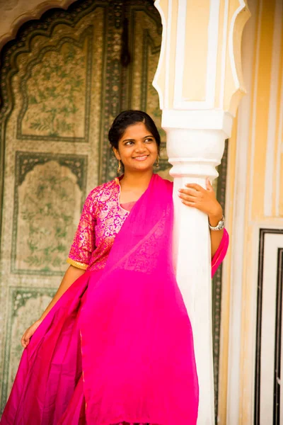 Indian young woman at city palace Jaipur in Rajasthan state, India