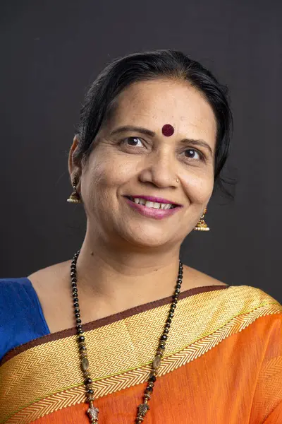 Portrait of a happy Indian woman in saree.