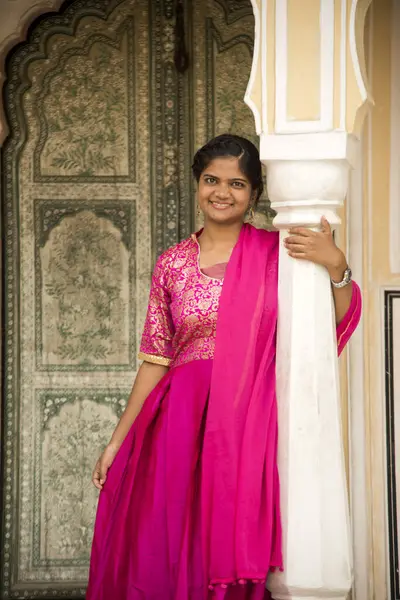 Indian young woman at city palace Jaipur in Rajasthan state, India