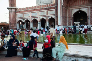 DELHI, INDIA, August 23, 2022 : Worshipers and tourist visit to the Jama Masjid Mosque, The mosque is the largest and most famous in India clipart