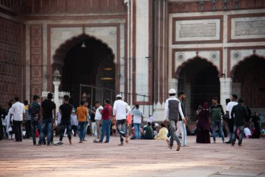 DELHI, INDIA, August 23, 2022 : Worshipers and tourist visit to the Jama Masjid Mosque, The mosque is the largest and most famous in India clipart