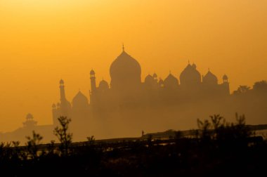 Taj Mahal at sunrise on the Yamuna River, UNESCO World Heritage Site. clipart