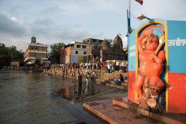 NASHIK, INDIA  29 AUGUST 2015 : Devotees take a holy bath at the in the river during the Simhastha Kumbh Mela. clipart