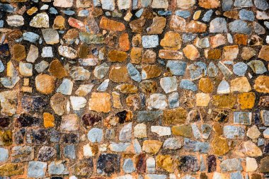 Antik taş duvarın arka planı, eski kale taşı duvar dokusu, taş yüzeylerin deseni..