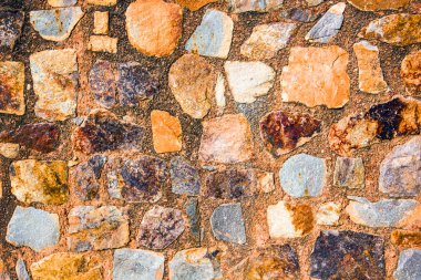 Antik taş duvarın arka planı, eski kale taşı duvar dokusu, taş yüzeylerin deseni..