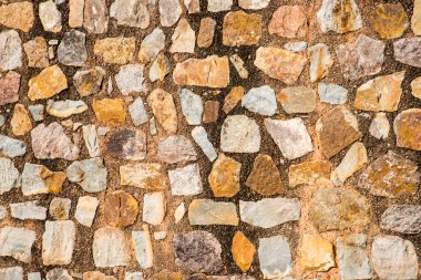 Antik taş duvarın arka planı, eski kale taşı duvar dokusu, taş yüzeylerin deseni..