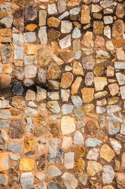 Antik taş duvarın arka planı, eski kale taşı duvar dokusu, taş yüzeylerin deseni..