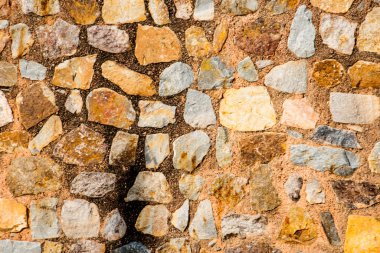 Antik taş duvarın arka planı, eski kale taşı duvar dokusu, taş yüzeylerin deseni..