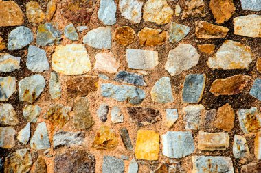 Antik taş duvarın arka planı, eski kale taşı duvar dokusu, taş yüzeylerin deseni..