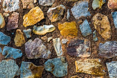 Antik taş duvarın arka planı, eski kale taşı duvar dokusu, taş yüzeylerin deseni..