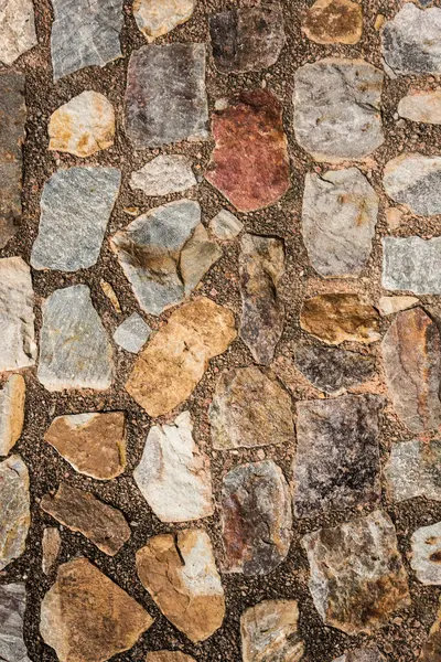 Antik taş duvarın arka planı, eski kale taşı duvar dokusu, taş yüzeylerin deseni..