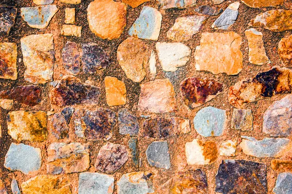 Antik taş duvarın arka planı, eski kale taşı duvar dokusu, taş yüzeylerin deseni..