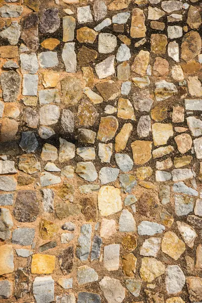 Antik taş duvarın arka planı, eski kale taşı duvar dokusu, taş yüzeylerin deseni..