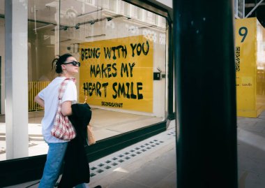 London - 09 October 2021 - Street Photography sign, Being With You Makes My Heart Smile, London UK clipart
