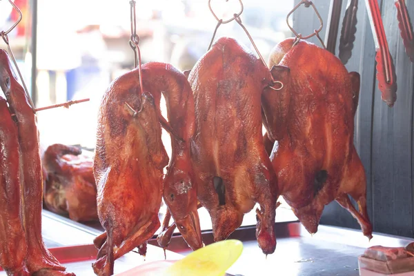 stock image Whole roasted chicken is placed in a tray.